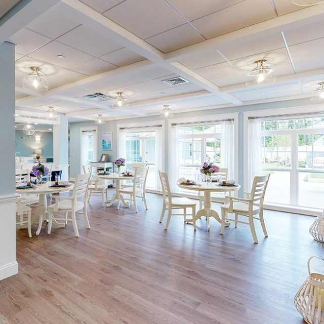 Open dining room with floor to ceiling windows